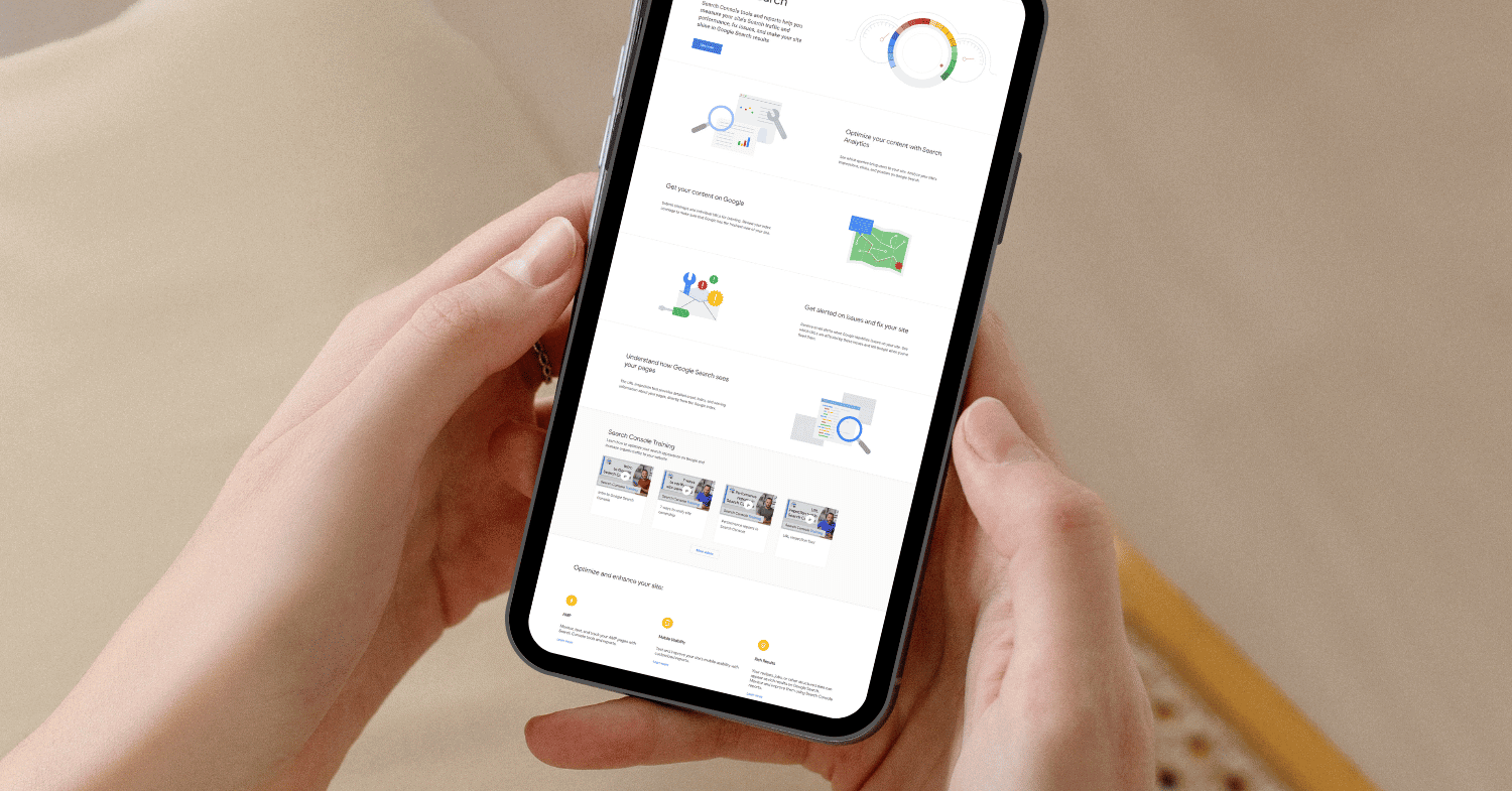 Hands holding a phone reviewing google search and analytics tools for a showit site